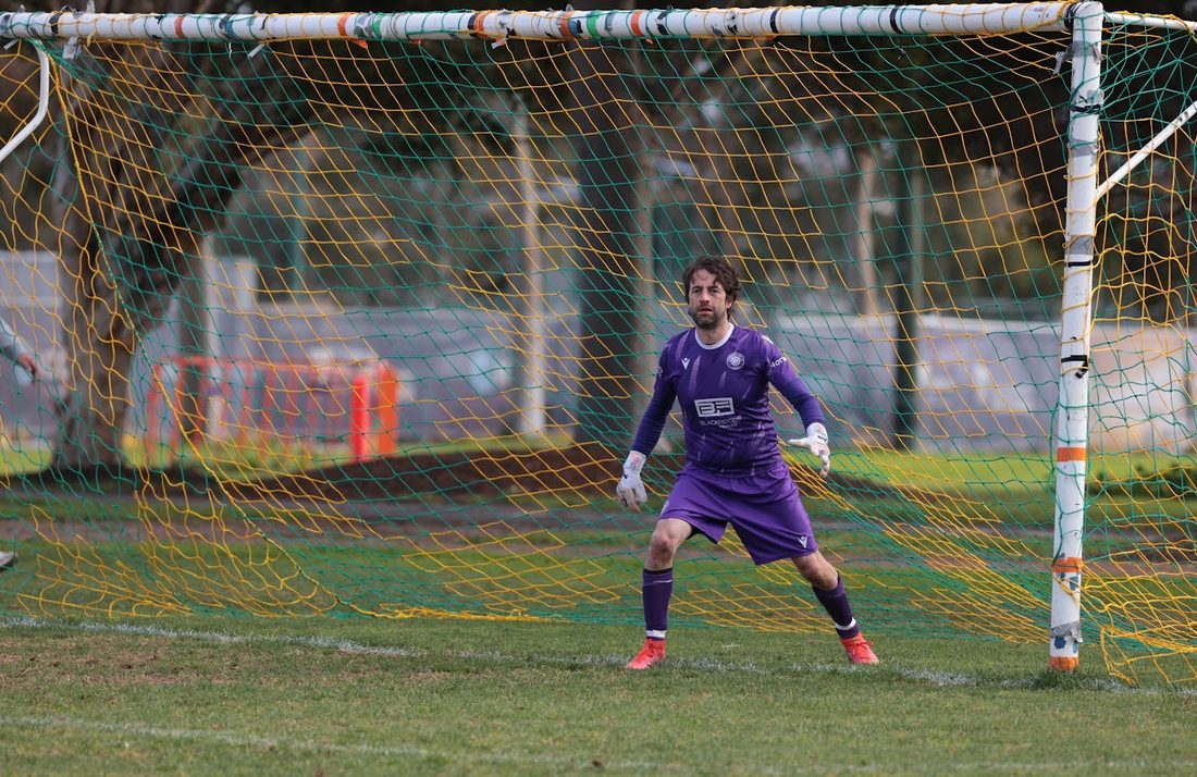 Ben Witten in goal for Middle Park FC, wearing a Blackridge Finance branded kit